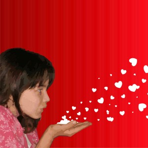 girl blowing hearts